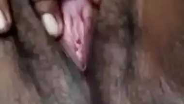 Young village girl spreads legs to rub virgin Desi bush in XXX video