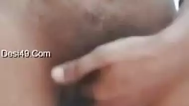 Big-tittied Desi gal strips and XXX pleases herself with fingering